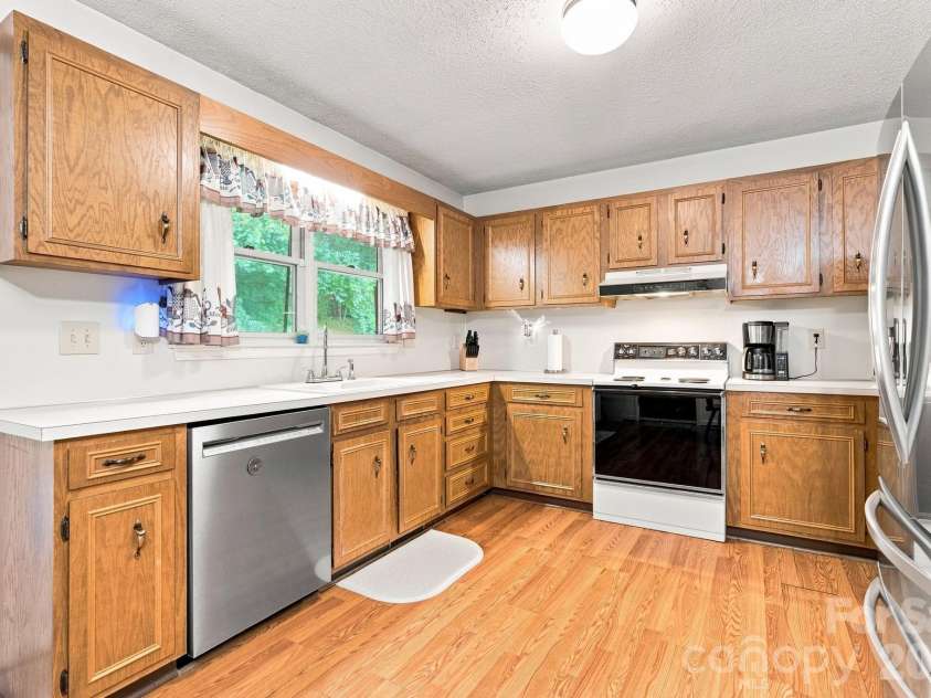 213 Hamilton Road, Troutman, NC 28166.  MLS# CAR4405468, YatesRealty ID 42054. Large kitchen with ample counter space and cabinets