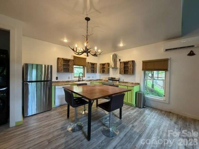 140 Falls Crossing Road, Burnsville, NC 28714.  MLS# CAR4393426, YatesRealty ID 42055. KITCHEN AND DINING AREA