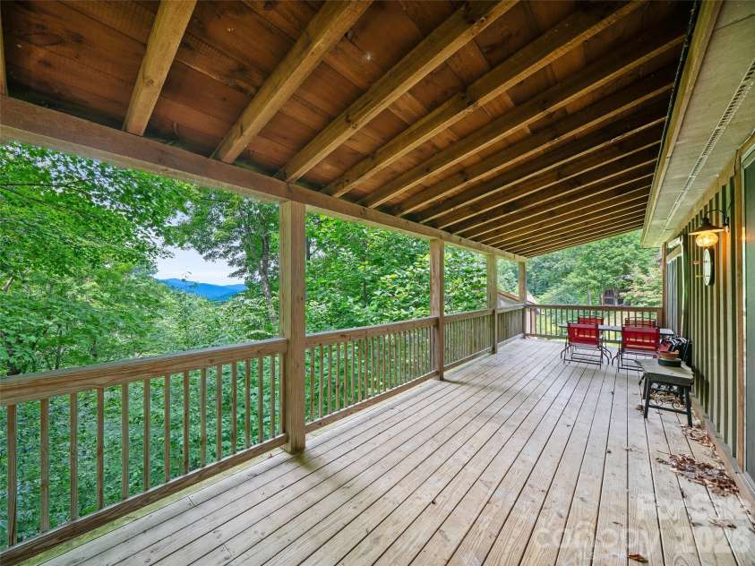 140 Falls Crossing Road, Burnsville, NC 28714.  MLS# CAR4393426, YatesRealty ID 42055. MAIN-LEVEL COVERED DECK