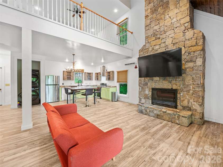 140 Falls Crossing Road, Burnsville, NC 28714.  MLS# CAR4393426, YatesRealty ID 42055. STONE-STACKED FIREPLACE