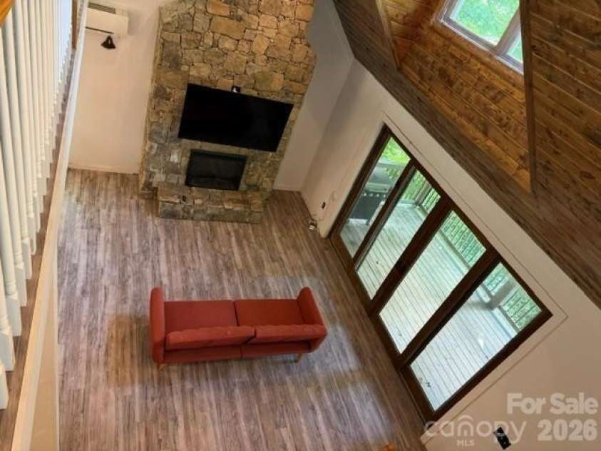 140 Falls Crossing Road, Burnsville, NC 28714.  MLS# CAR4393426, YatesRealty ID 42055. STONE-STACKED FP