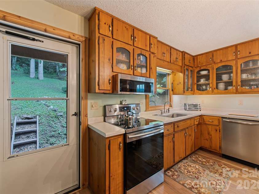 294 Laurel Branch Road, Maggie Valley, NC 28751.  MLS# CAR4411437, YatesRealty ID 42056. Beautiful wood kitchen cabinets
