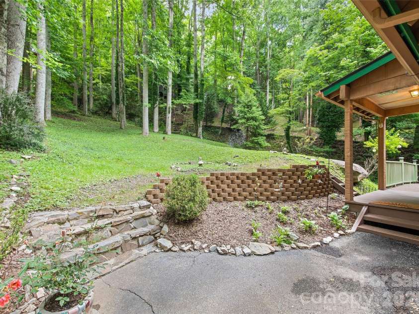 294 Laurel Branch Road, Maggie Valley, NC 28751.  MLS# CAR4411437, YatesRealty ID 42056. Beautifully landscaped retaining wall