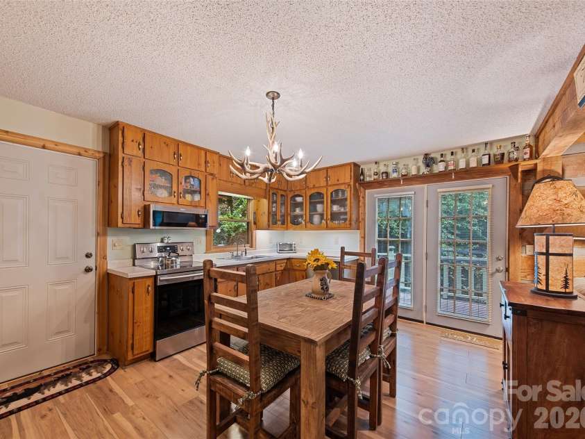294 Laurel Branch Road, Maggie Valley, NC 28751.  MLS# CAR4411437, YatesRealty ID 42056. Kitchen and dining area