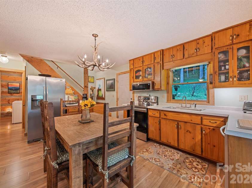 294 Laurel Branch Road, Maggie Valley, NC 28751.  MLS# CAR4411437, YatesRealty ID 42056. Kitchen and dining area