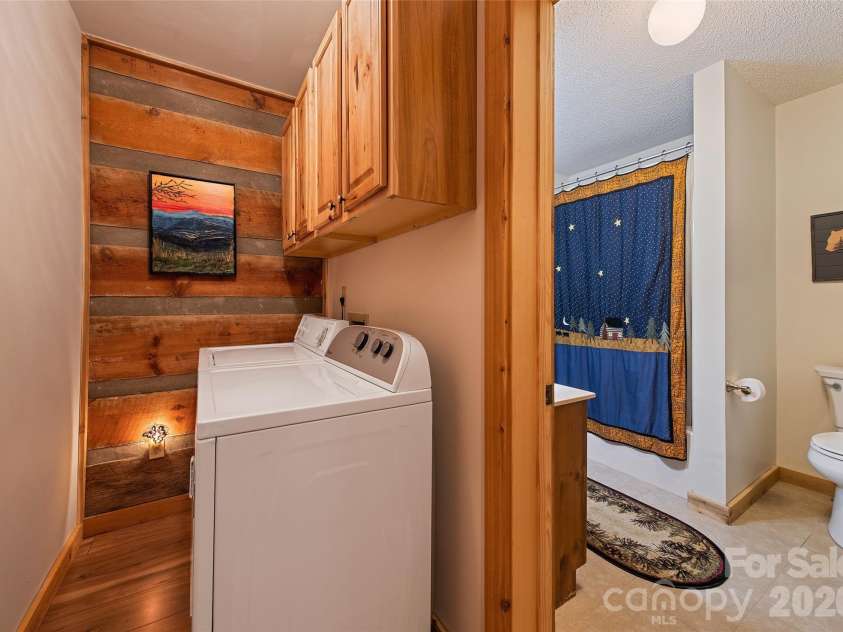 294 Laurel Branch Road, Maggie Valley, NC 28751.  MLS# CAR4411437, YatesRealty ID 42056. Laundry room conveniently located