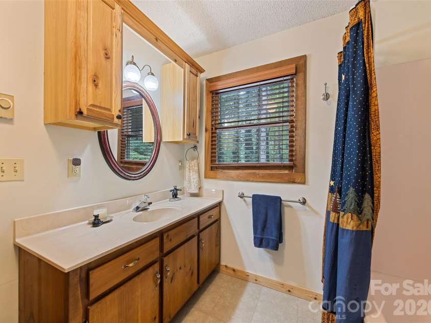 294 Laurel Branch Road, Maggie Valley, NC 28751.  MLS# CAR4411437, YatesRealty ID 42056. Main level full bath