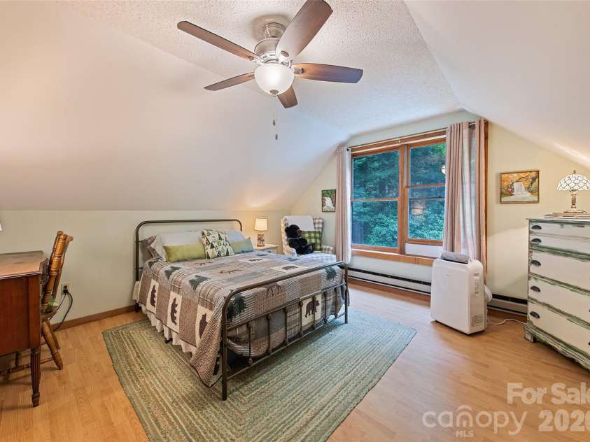 294 Laurel Branch Road, Maggie Valley, NC 28751.  MLS# CAR4411437, YatesRealty ID 42056. Spacious upper floor bedroom