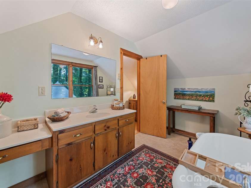 294 Laurel Branch Road, Maggie Valley, NC 28751.  MLS# CAR4411437, YatesRealty ID 42056. Spacious upper level bath with soaking cub
