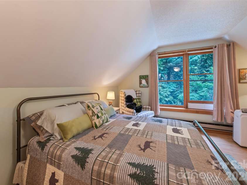 294 Laurel Branch Road, Maggie Valley, NC 28751.  MLS# CAR4411437, YatesRealty ID 42056. Upper floor bedroom