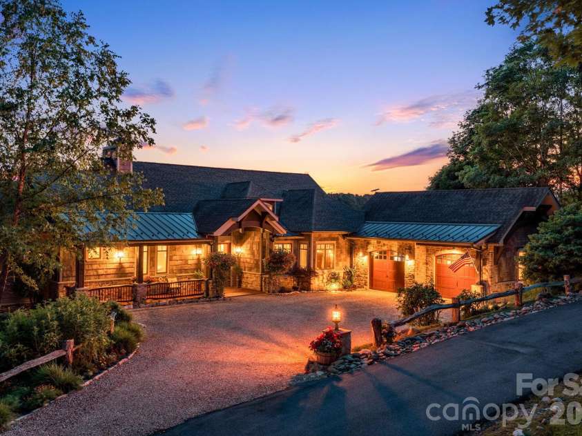 817 Running Cedar Lane, Mars Hill, NC 28754.  MLS# CAR4407984, YatesRealty ID 42073. A spacious, level driveway and attached two-car garage provide easy year round access a true luxury in the mountains.