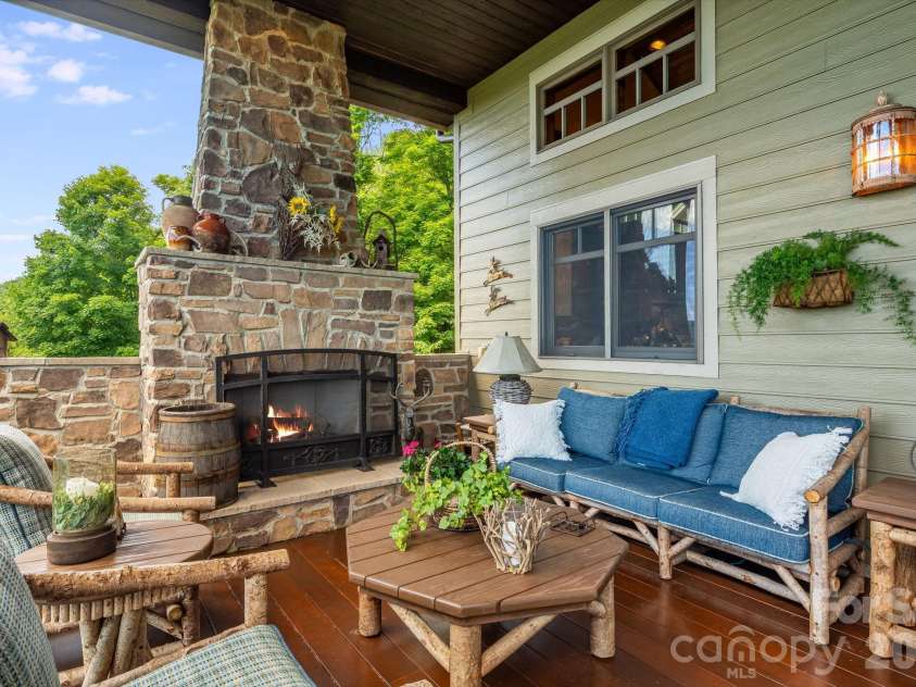 817 Running Cedar Lane, Mars Hill, NC 28754.  MLS# CAR4407984, YatesRealty ID 42073. Fireside seating on the upstairs covered deck.