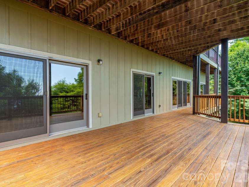 817 Running Cedar Lane, Mars Hill, NC 28754.  MLS# CAR4407984, YatesRealty ID 42073. Spacious covered deck off of the lowest unfinished