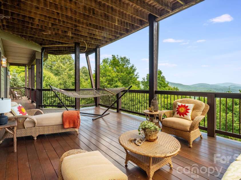 817 Running Cedar Lane, Mars Hill, NC 28754.  MLS# CAR4407984, YatesRealty ID 42073. Spacious lower covered deck.