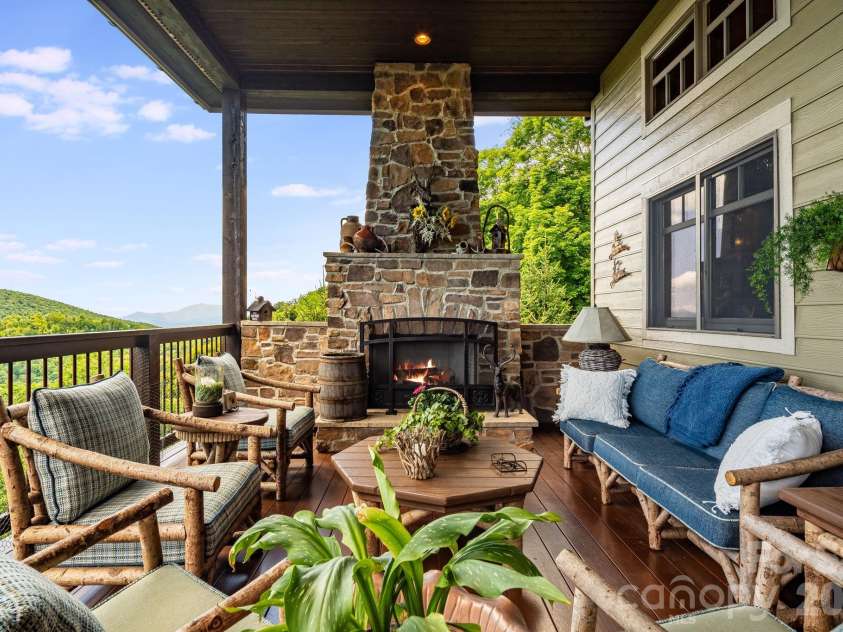 817 Running Cedar Lane, Mars Hill, NC 28754.  MLS# CAR4407984, YatesRealty ID 42073. Upstairs covered deck with fireplace and mountain views.