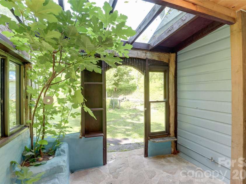 435 Mountain Cove Road, Marshall, NC 28753.  MLS# CAR4396478, YatesRealty ID 42077. Charming back patio