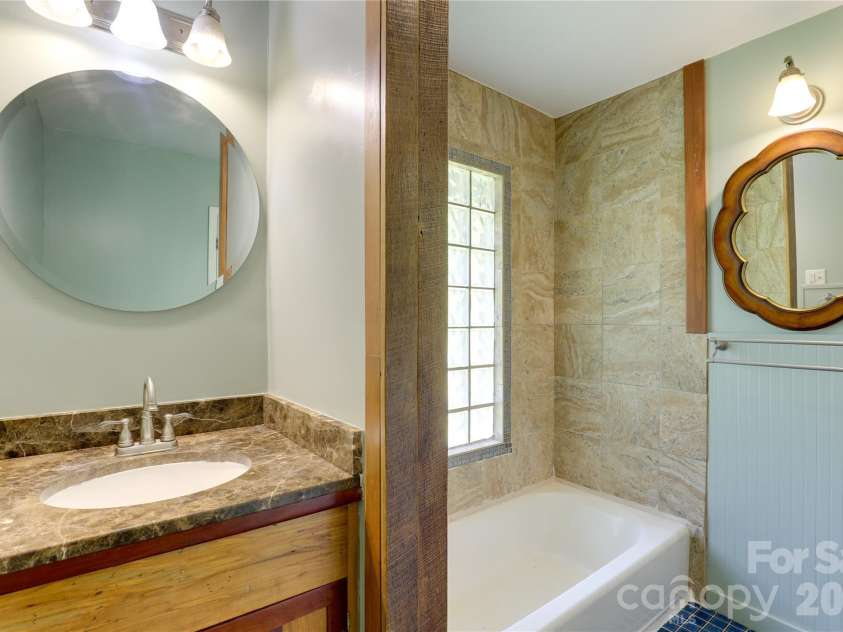 435 Mountain Cove Road, Marshall, NC 28753.  MLS# CAR4396478, YatesRealty ID 42077. Main level bathroom