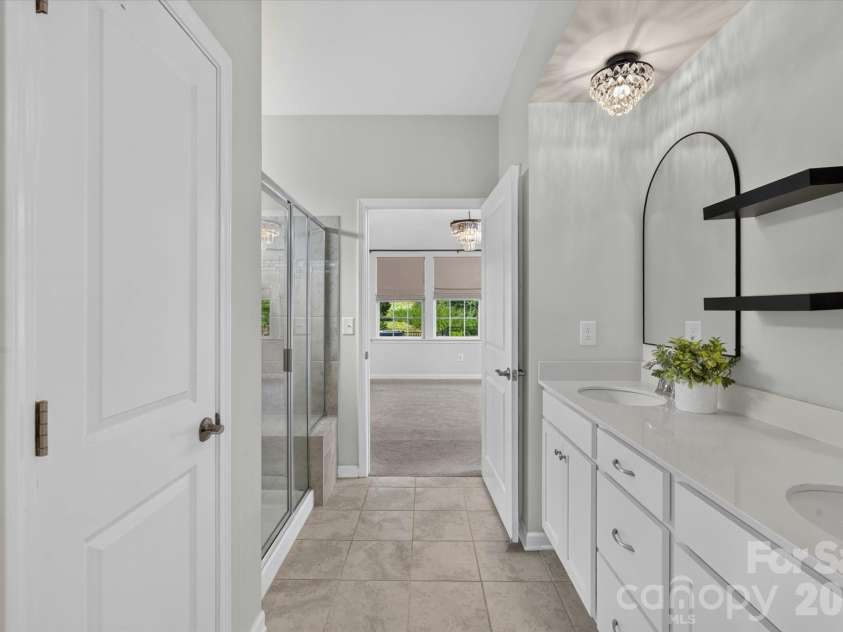 14016 Southbridge Forest Drive, Charlotte, NC 28273.  MLS# CAR4404050, YatesRealty ID 42102. View from Bath into Primary Bedroom