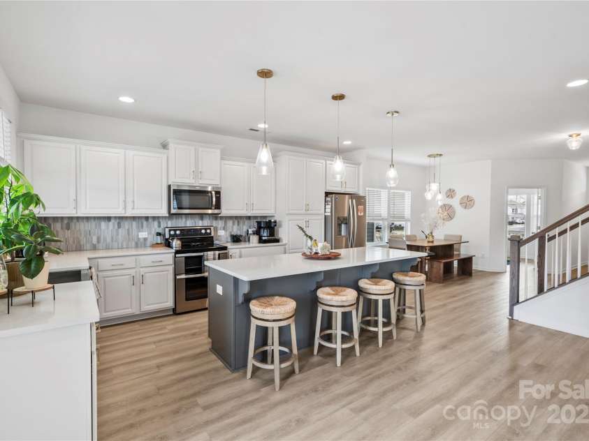 5104 Thomasville Drive, Belmont, NC 28012.  MLS# CAR4242636, YatesRealty ID 4211. Kitchen island & breakfast bar for busy mornings