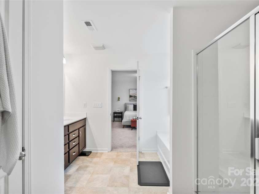 5104 Thomasville Drive, Belmont, NC 28012.  MLS# CAR4242636, YatesRealty ID 4211. Primary bathroom with soaking tub and walk in shower