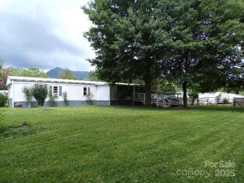 71 Flat Creek Road, Waynesville, NC 28785.  MLS# CAR4289223, YatesRealty ID 4211. Backyard