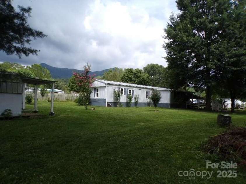 71 Flat Creek Road, Waynesville, NC 28785.  MLS# CAR4289223, YatesRealty ID 4211. Backyard