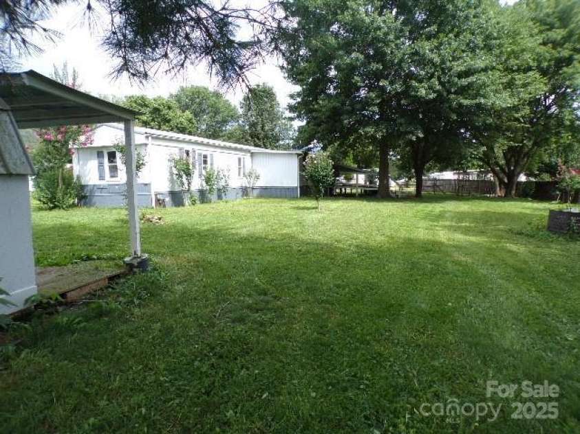 71 Flat Creek Road, Waynesville, NC 28785.  MLS# CAR4289223, YatesRealty ID 4211. Backyard