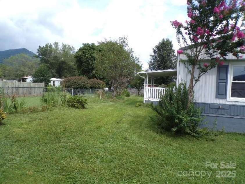 71 Flat Creek Road, Waynesville, NC 28785.  MLS# CAR4289223, YatesRealty ID 4211. Front yard