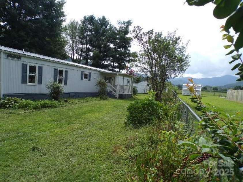 71 Flat Creek Road, Waynesville, NC 28785.  MLS# CAR4289223, YatesRealty ID 4211. Front yard