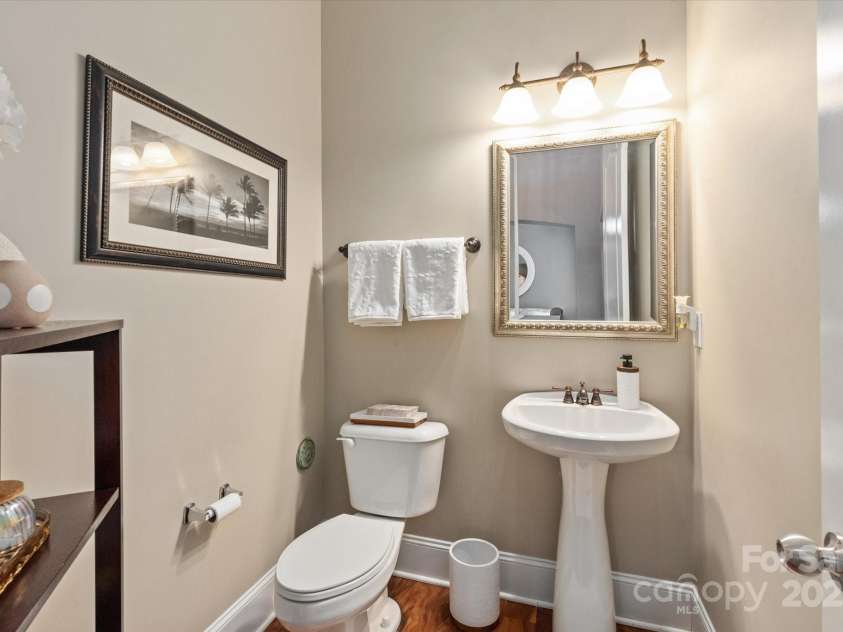 11308 Wheat Ridge Road, Charlotte, NC 28277.  MLS# CAR4241331, YatesRealty ID 4212. Powder room with pedestal sink on main level