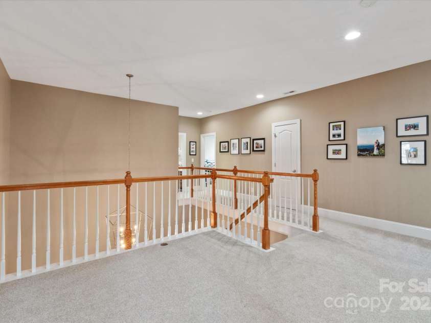 11308 Wheat Ridge Road, Charlotte, NC 28277.  MLS# CAR4241331, YatesRealty ID 4212. Upstairs hallways boasts spacious loft area