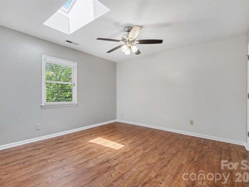 5315 Ruth Drive, Charlotte, NC 28215.  MLS# CAR4407741, YatesRealty ID 42129. Converted, finished structure: Bedroom has skylight and ceiling fan