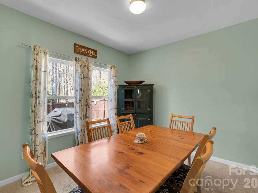15039 Ockeechobee Court, Mint Hill, NC 28227.  MLS# CAR4354276, YatesRealty ID 4213. Dining area off the kitchen with views of the backyard and trees