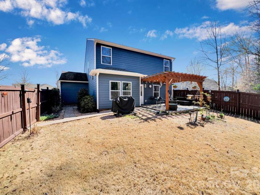 15039 Ockeechobee Court, Mint Hill, NC 28227.  MLS# CAR4354276, YatesRealty ID 4213. Walk way area and path to area to store garbage cans