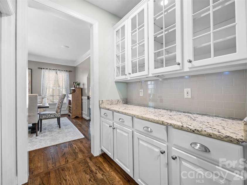 233 Squirrel Lane, Clover, SC 29710.  MLS# CAR4394508, YatesRealty ID 42132. Butler's pantry connecting dining room and kitchen