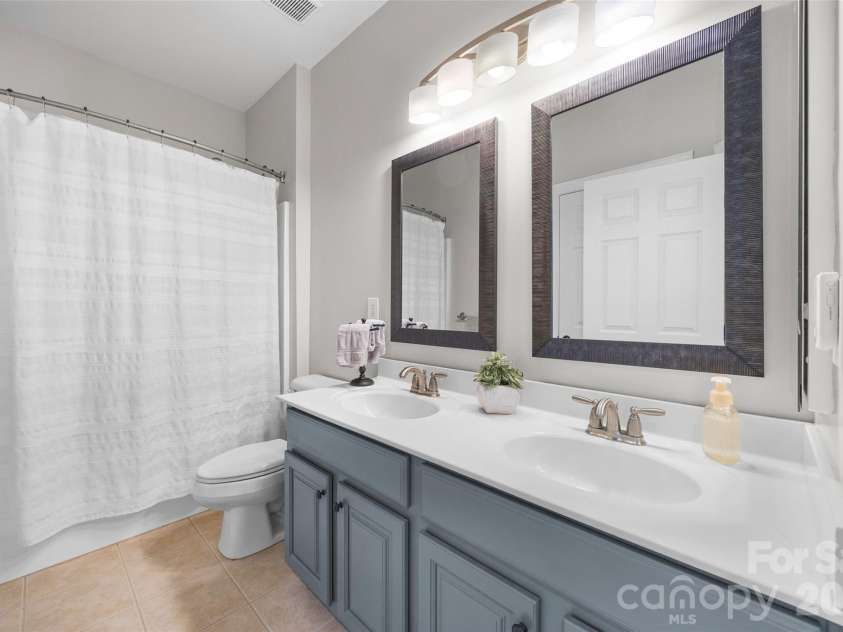 233 Squirrel Lane, Clover, SC 29710.  MLS# CAR4394508, YatesRealty ID 42132. Hall bath upstairs with double sinks