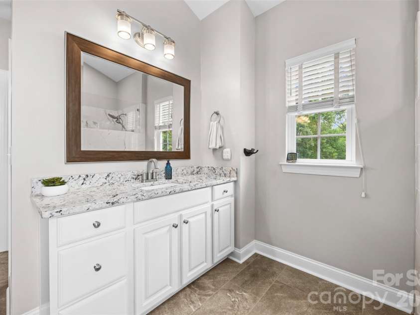 233 Squirrel Lane, Clover, SC 29710.  MLS# CAR4394508, YatesRealty ID 42132. Remodeled primary bath with separate vanities
