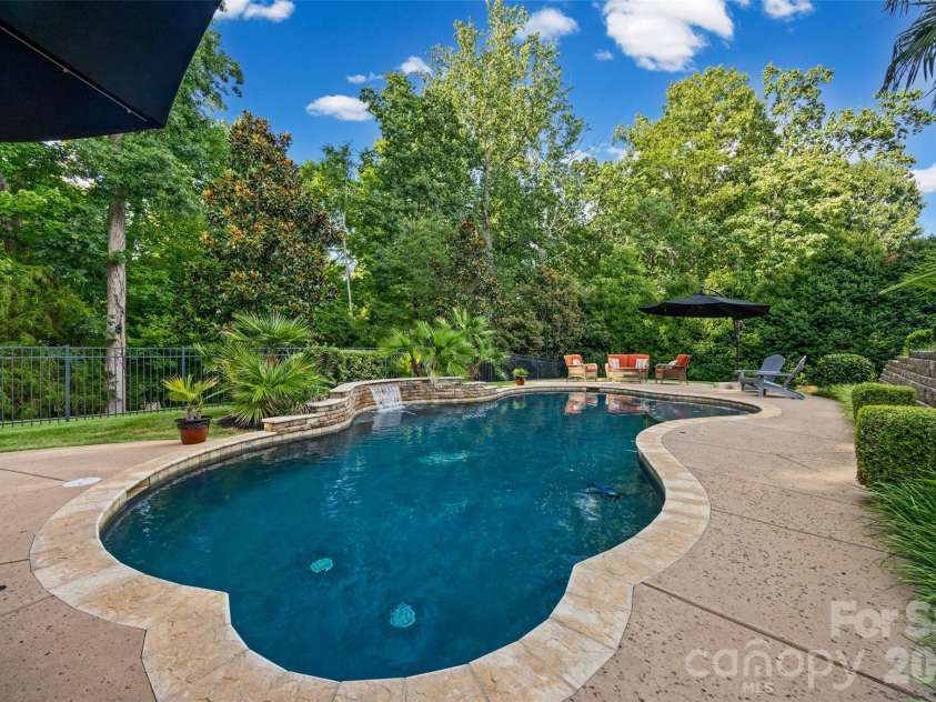 233 Squirrel Lane, Clover, SC 29710.  MLS# CAR4394508, YatesRealty ID 42132. Salt water pool with waterfall feature