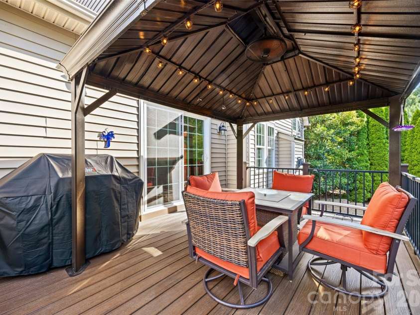 233 Squirrel Lane, Clover, SC 29710.  MLS# CAR4394508, YatesRealty ID 42132. Trex deck with aluminum railing overlooking private backyard