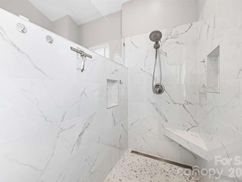 233 Squirrel Lane, Clover, SC 29710.  MLS# CAR4394508, YatesRealty ID 42132. Walk-in spa shower in primary bathroom