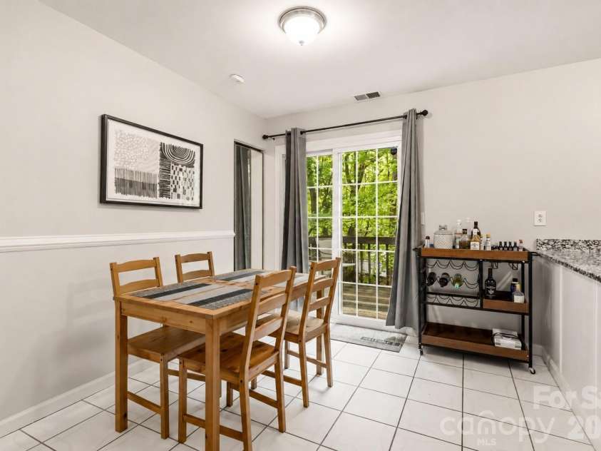 6355 Windsor Gate Lane, Charlotte, NC 28215.  MLS# CAR4406081, YatesRealty ID 42134. Spacious eating area - sliders lead to back deck