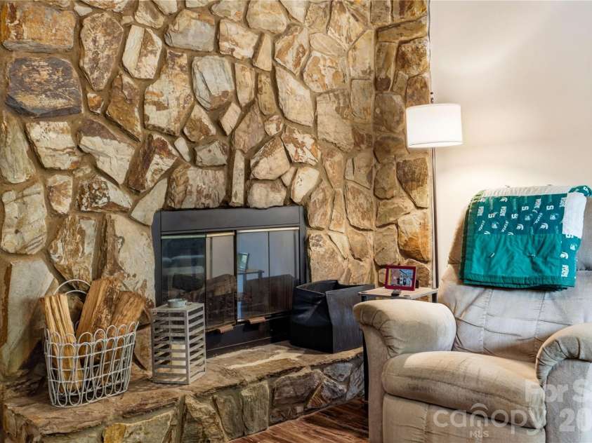 6355 Windsor Gate Lane, Charlotte, NC 28215.  MLS# CAR4406081, YatesRealty ID 42134. Stone fireplace for those chilly evenings