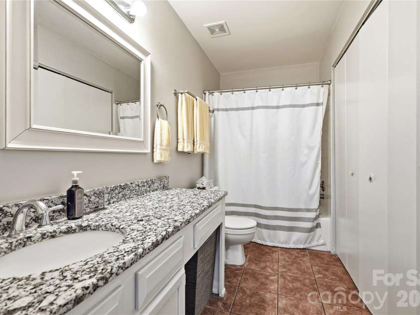 6355 Windsor Gate Lane, Charlotte, NC 28215.  MLS# CAR4406081, YatesRealty ID 42134. Tiled bathroom floor with spacious countertop