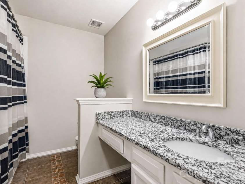 6355 Windsor Gate Lane, Charlotte, NC 28215.  MLS# CAR4406081, YatesRealty ID 42134. Updated secondary bathroom
