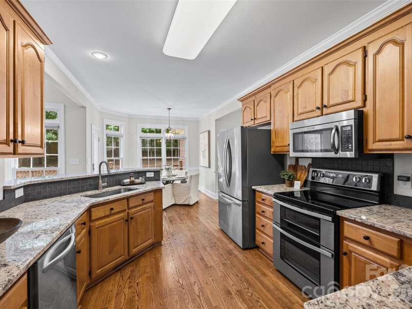 5385 Apple Glen Drive, Harrisburg, NC 28075.  MLS# CAR4407413, YatesRealty ID 42152. NEW TILE BACKSPLASH/FRIDGE INCLUDED