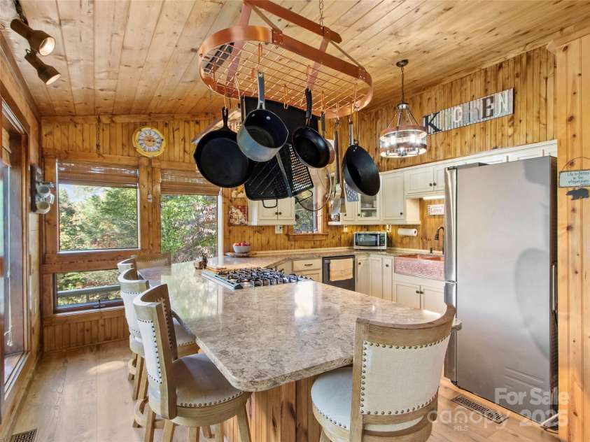 354 Big Ridge Road, Burnsville, NC 28714.  MLS# CAR4311834, YatesRealty ID 42174. Kitchen with large Island and seating