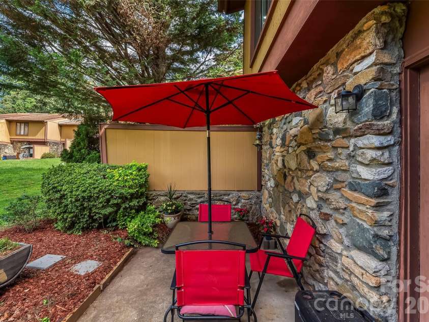 119 Colony Drive, Arden, NC 28704.  MLS# CAR4408014, YatesRealty ID 42177. Tranquil rear patio