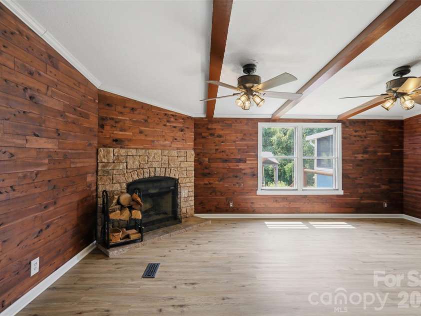8162 Nc 16 Highway, Moravian Falls, NC 28654.  MLS# CAR4410384, YatesRealty ID 42188. Den with fireplace