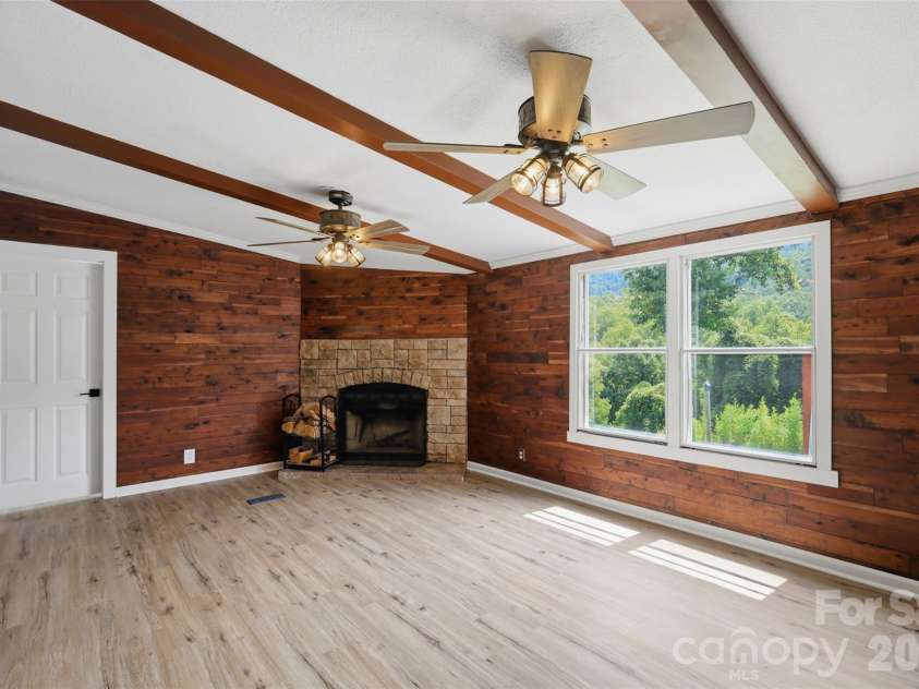 8162 Nc 16 Highway, Moravian Falls, NC 28654.  MLS# CAR4410384, YatesRealty ID 42188. Den with fireplace