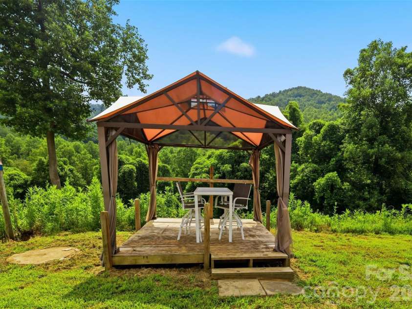 8162 Nc 16 Highway, Moravian Falls, NC 28654.  MLS# CAR4410384, YatesRealty ID 42188. Detached deck in backyard